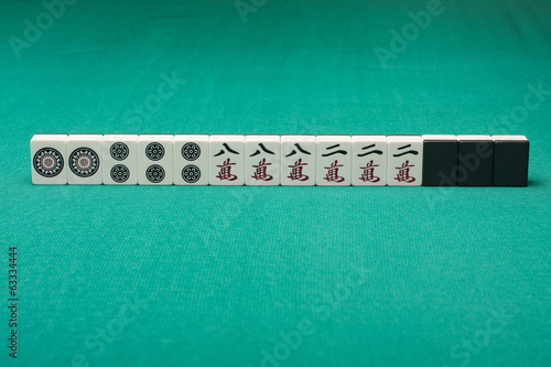 Smooth table surface with a mahjong on it photo