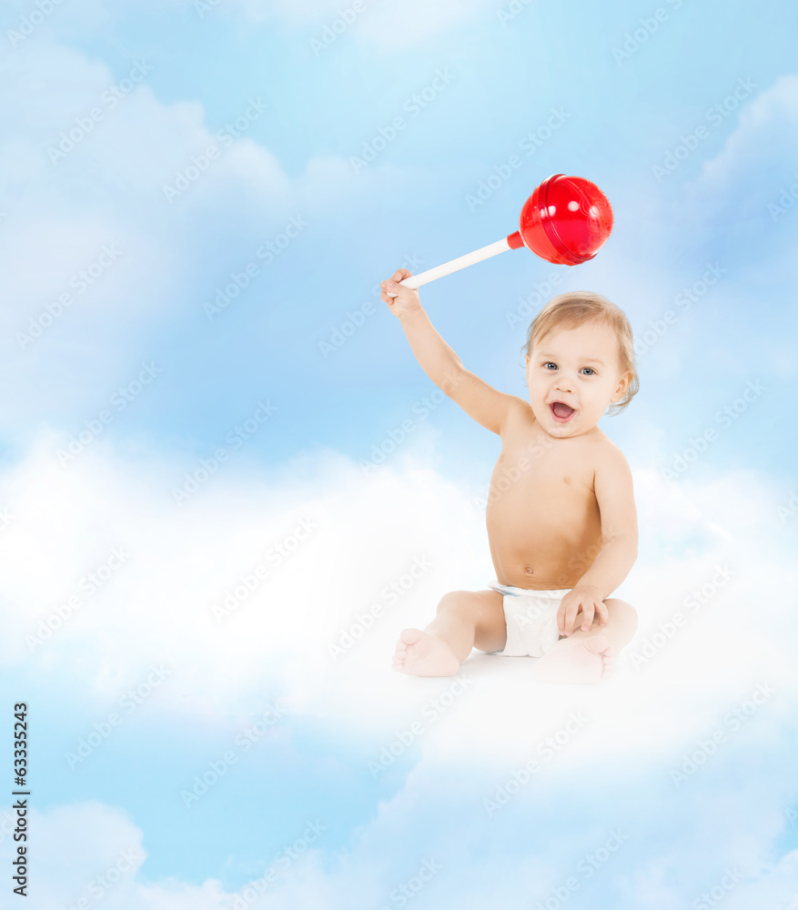 cute little boy playing with big lollipop cute little boy playing with big lollipop