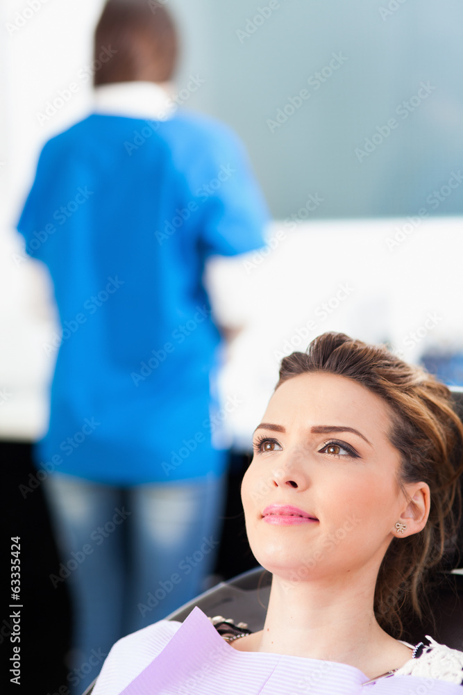 Woman patient at the dentist waiting to be checked up Woman patient at the dentist waiting to be checked up