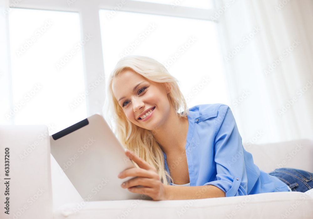 smiling woman with tablet pc computer at home smiling woman with tablet pc computer at home
