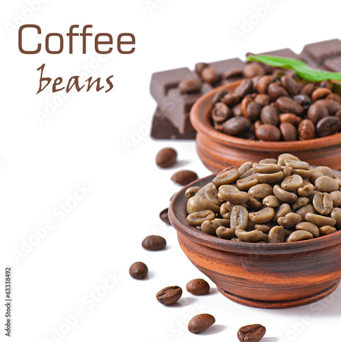Green and brown coffee beans in bowls