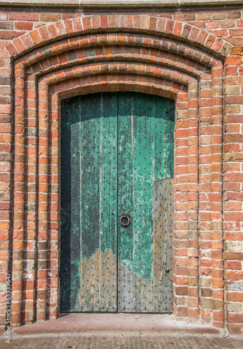 Green door of the church of Loppersum photo