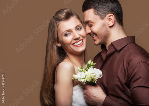 Beautiful couple in love with flowers tulips.Valentine's Day