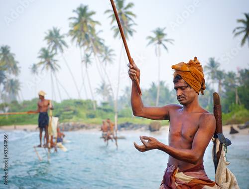 Stilt fishermen in Sri Lanka photo