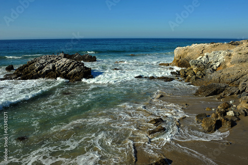 Foto Oceanside beach and rocks at Leo Carill Beach