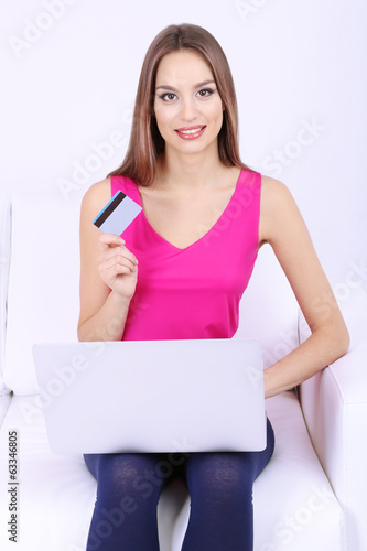 Beautiful young woman sitting
