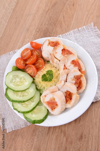 Delicious chicken roll on plate on table close-up