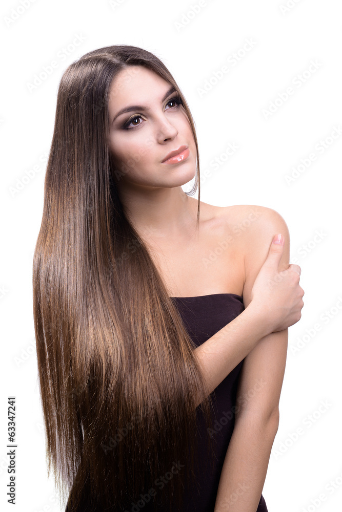 Naklejka premium Beautiful young woman with long hair isolated on white