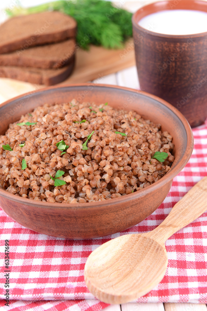 Boiled buckwheat in bowl on table close-up Boiled buckwheat in bowl on table close-up