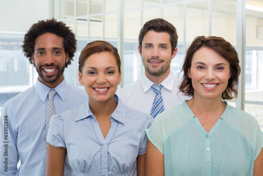Smiling young business people in office Smiling young business people in office