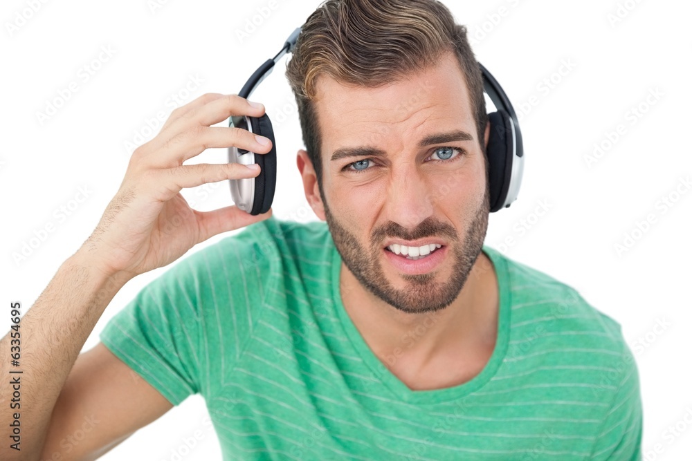 Portrait of a irritated young man with headphones Portrait of a irritated young man with headphones