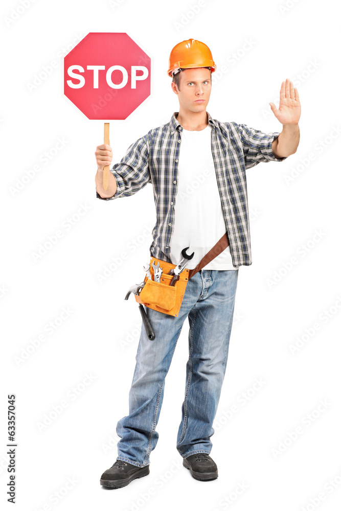 Construction worker holding a stop sign Construction worker holding a stop sign