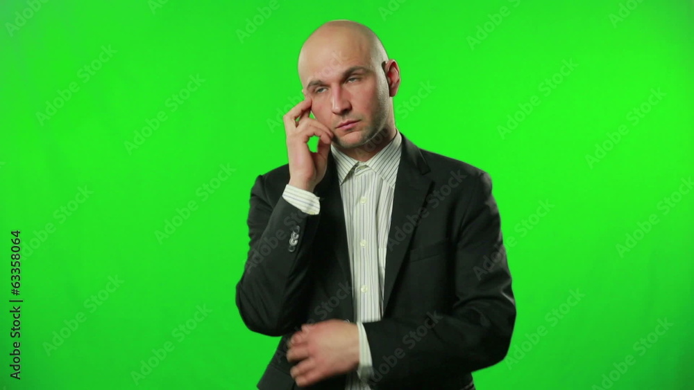 Portrait of a thinking businessman against a green screen Portrait of a thinking businessman against a green screen