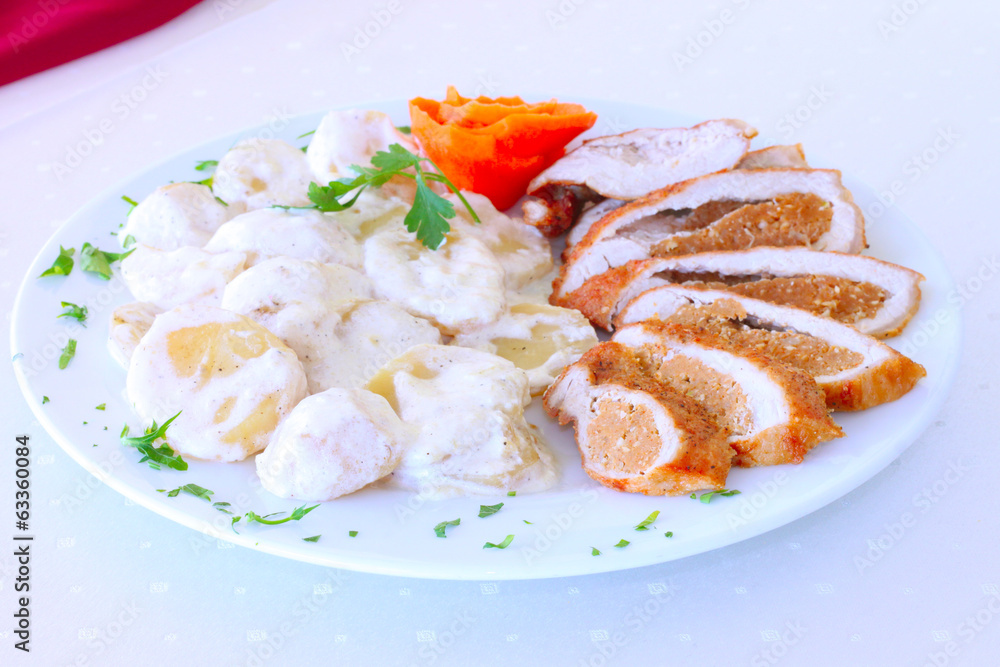 traditional steak with potatoes and white sauce close up traditional steak with potatoes and white sauce close up