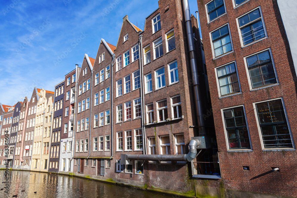 Obraz premium Colorful living houses. Canal in Amsterdam, Netherlands