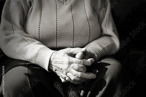 Closeup of an old woman's hands joined