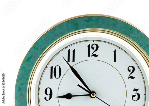 Nine o'clock on big wall watch isolated