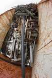 container filled with ferrous material and old rusted iron parts