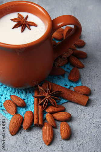 Fototapeta Naklejka Na Ścianę i Meble -  Almond milk in jug with almonds in bowl,