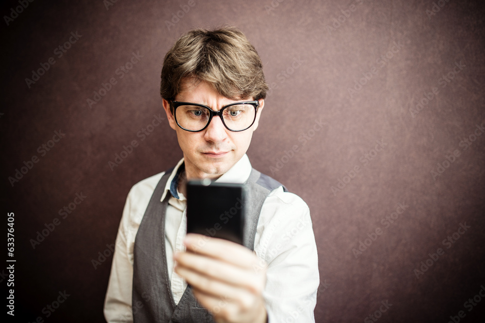 Funny guy using mobile smartphone Funny guy using mobile smartphone