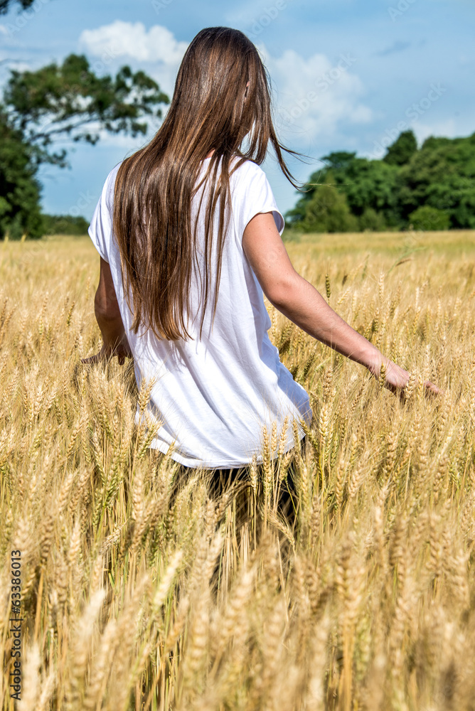 Happy Young Women walking a Golden field. Happy Young Women walking a Golden field.