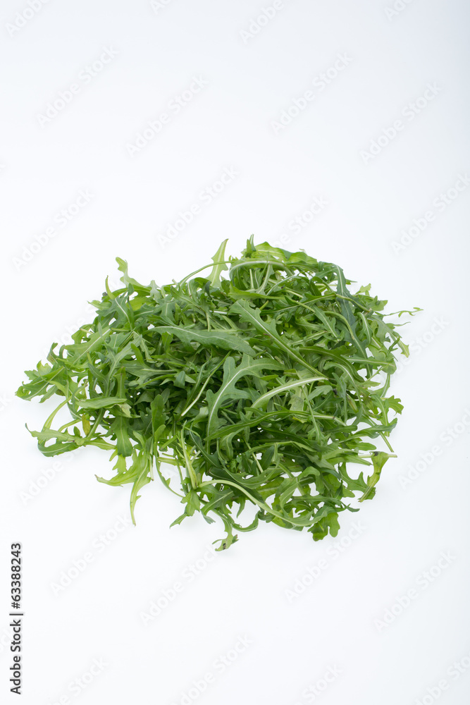 Heap of ruccola leaves isolated on white background Heap of ruccola leaves isolated on white background