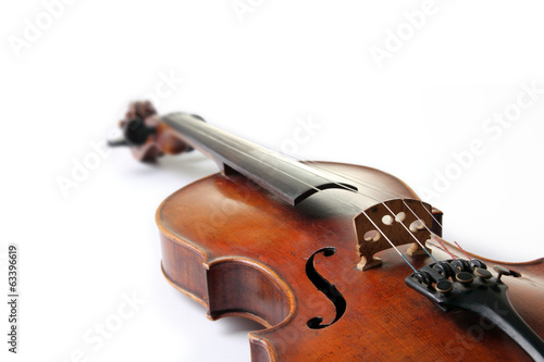 Old scratched violin on white background