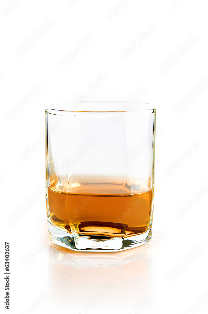 Empty glass with flowing whiskey Empty glass with flowing whiskey