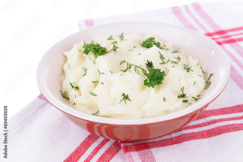 Delicious mashed potatoes with greens in bowl on table close-up Delicious mashed potatoes with greens in bowl on table close-up