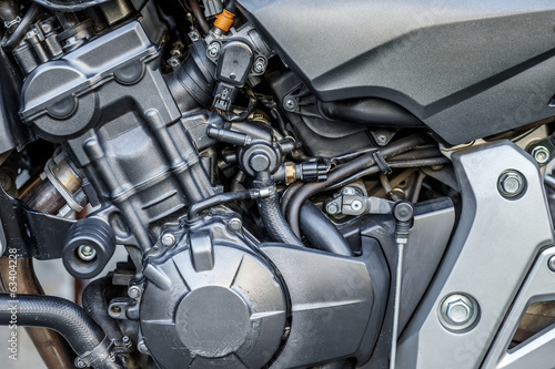 Motorcycle engine close-up detail background © ArtushFoto
