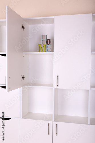 Shelves with decorative letter close up