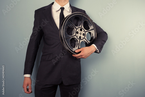 Young producer with film reel photo