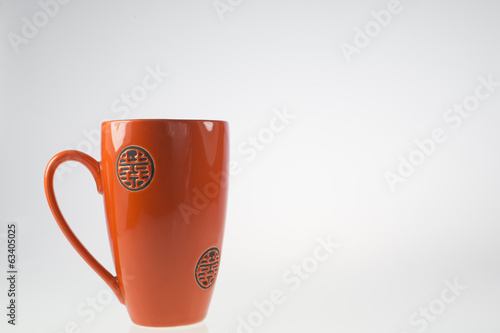 Obraz na płótnie tazza arancio/rosso su sfondo bianco w salonie