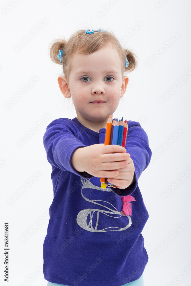 Little girl shows a stack of pencils Little girl shows a stack of pencils