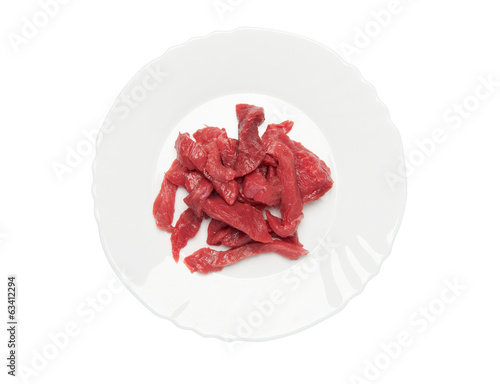raw meat on a plate over white background. clipping path