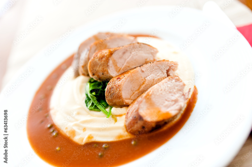 Mashed potatoes with grilled pork as main course Mashed potatoes with grilled pork as main course