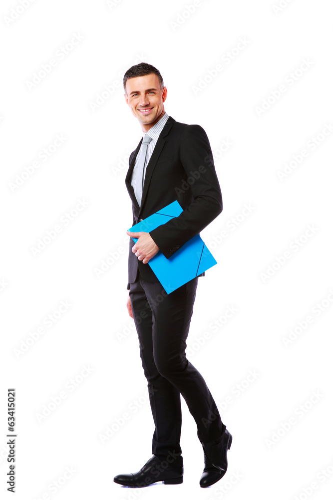 Businessman standing with blue folder in hands Businessman standing with blue folder in hands
