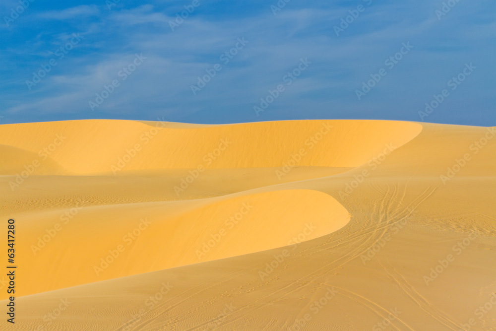 Sand dunes against blue sky Sand dunes against blue sky