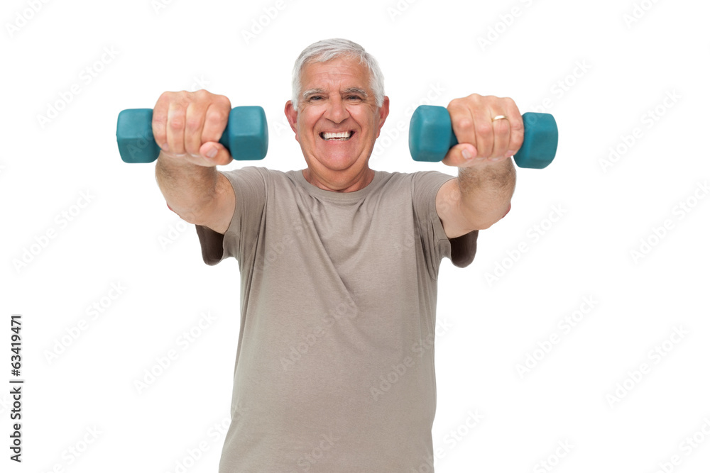 Portrait of a happy senior man exercising with dumbbells Portrait of a happy senior man exercising with dumbbells