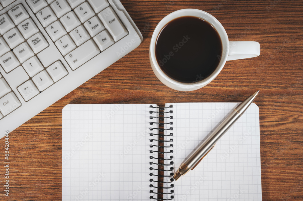 Blank notepad, keyboard, pen and coffee cup Blank notepad, keyboard, pen and coffee cup