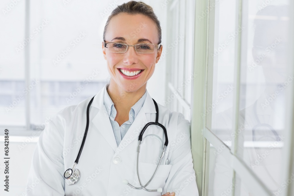 Beautiful happy female doctor in hospital Beautiful happy female doctor in hospital