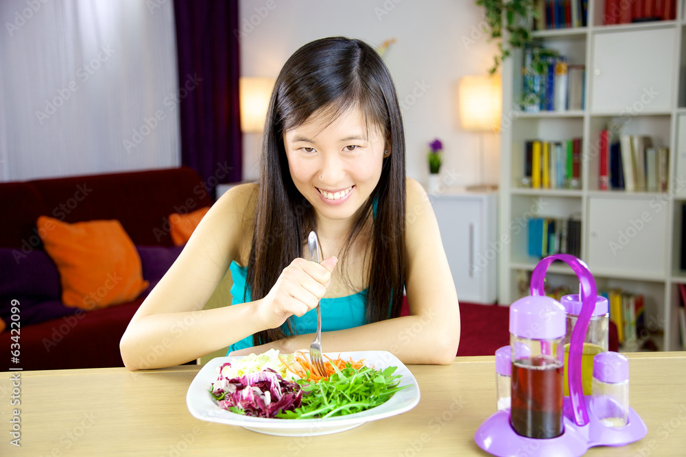 Chinese american girl ready to start diet with salad Chinese american girl ready to start diet with salad