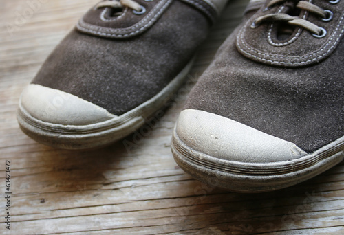 Old shoes on wooden floor