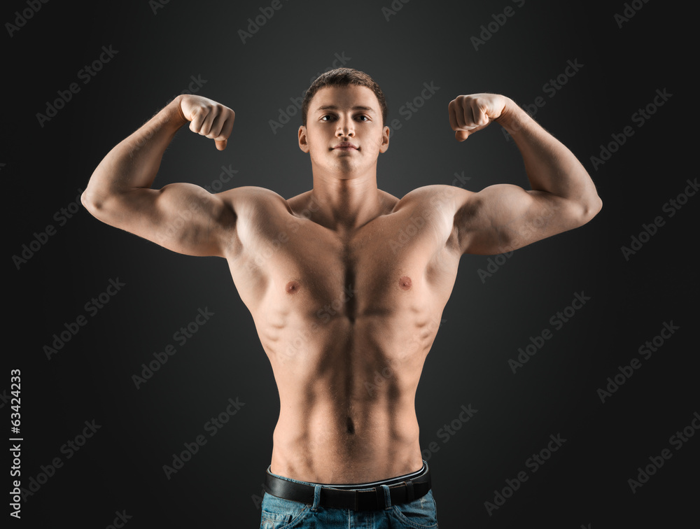 bodybuilder showing muscles in the arms