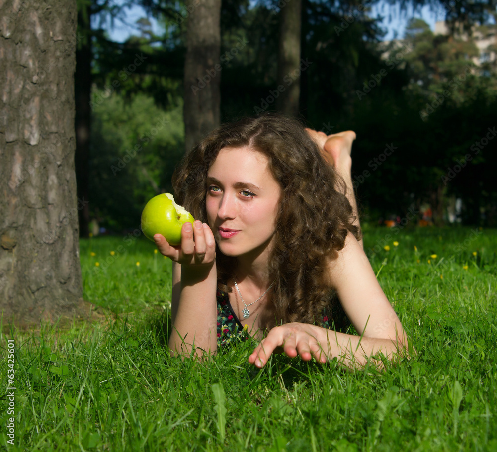 beautiful young woman eating apple outdoors beautiful young woman eating apple outdoors