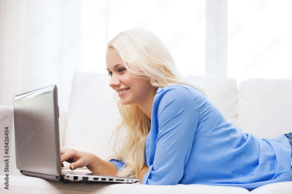smiling woman with laptop computer at home smiling woman with laptop computer at home