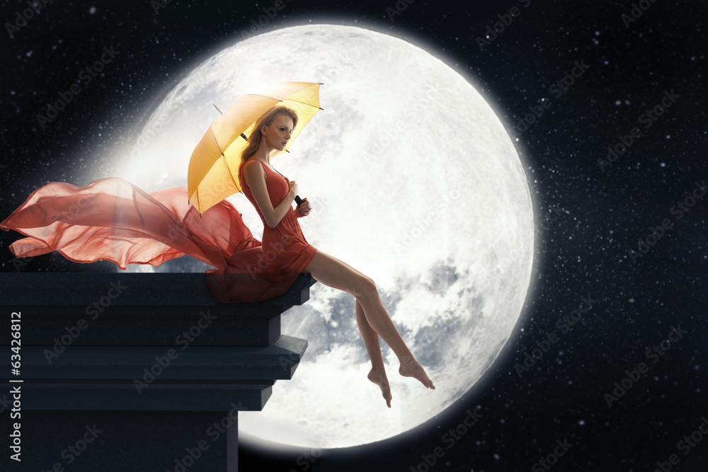 Woman with umbrella over full moon background Woman with umbrella over full moon background