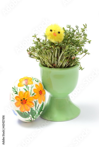 Easter chicken on watercress in green cup and painted egg