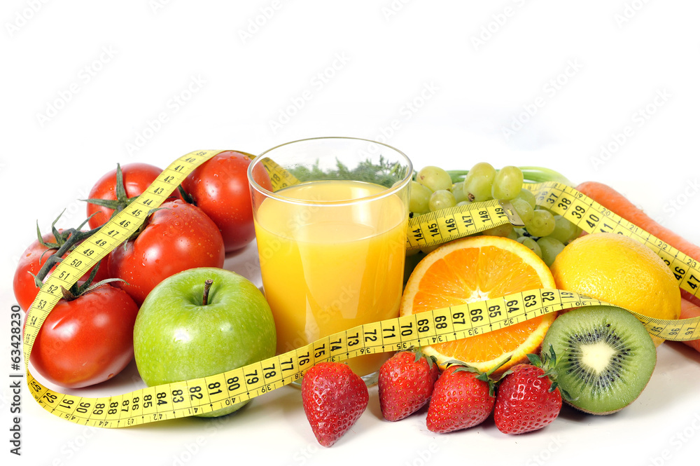 fruit , vegetables and orange juice wrapped in measure tape fruit , vegetables and orange juice wrapped in measure tape