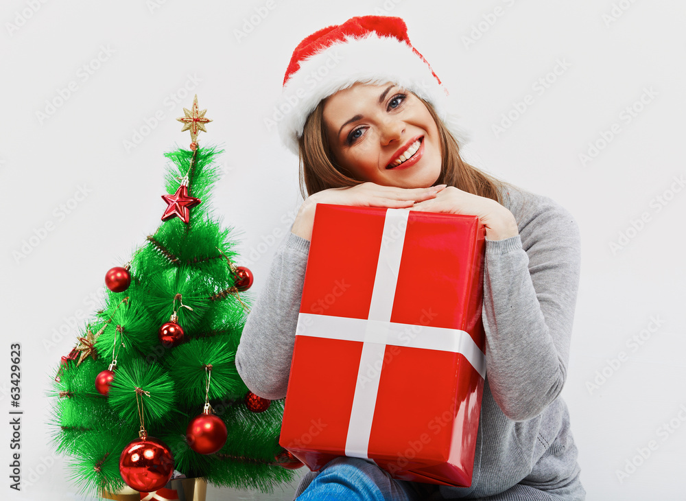 Christmas santa woman with christmas gift. Isolated smiling wom Christmas santa woman with christmas gift. Isolated smiling wom